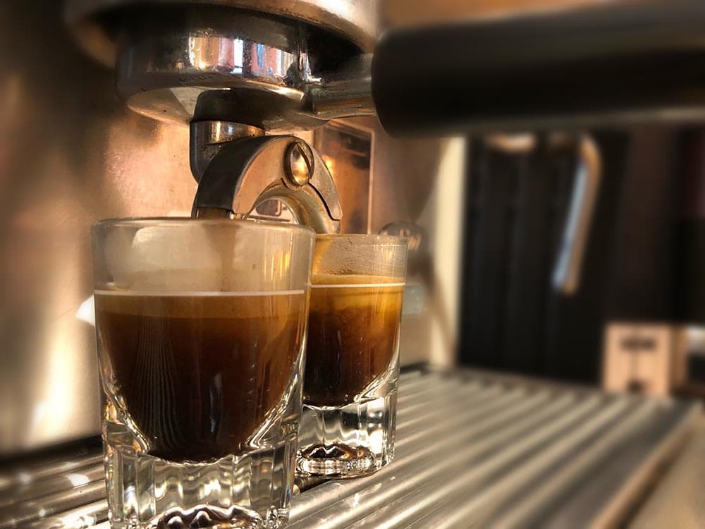 Two espresso shots pulling on the machine at the Lakewood shop